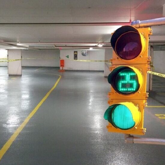 Temporary traffic light with countdown light in use during parking garage restoration